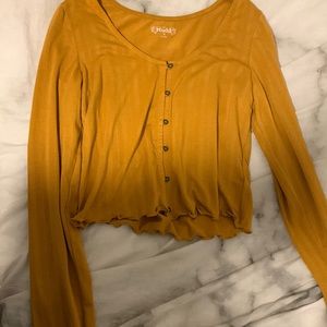 orange-brown button up crop top :)